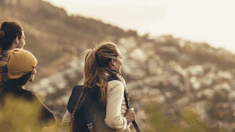 People waking in nature wearing hiking gear